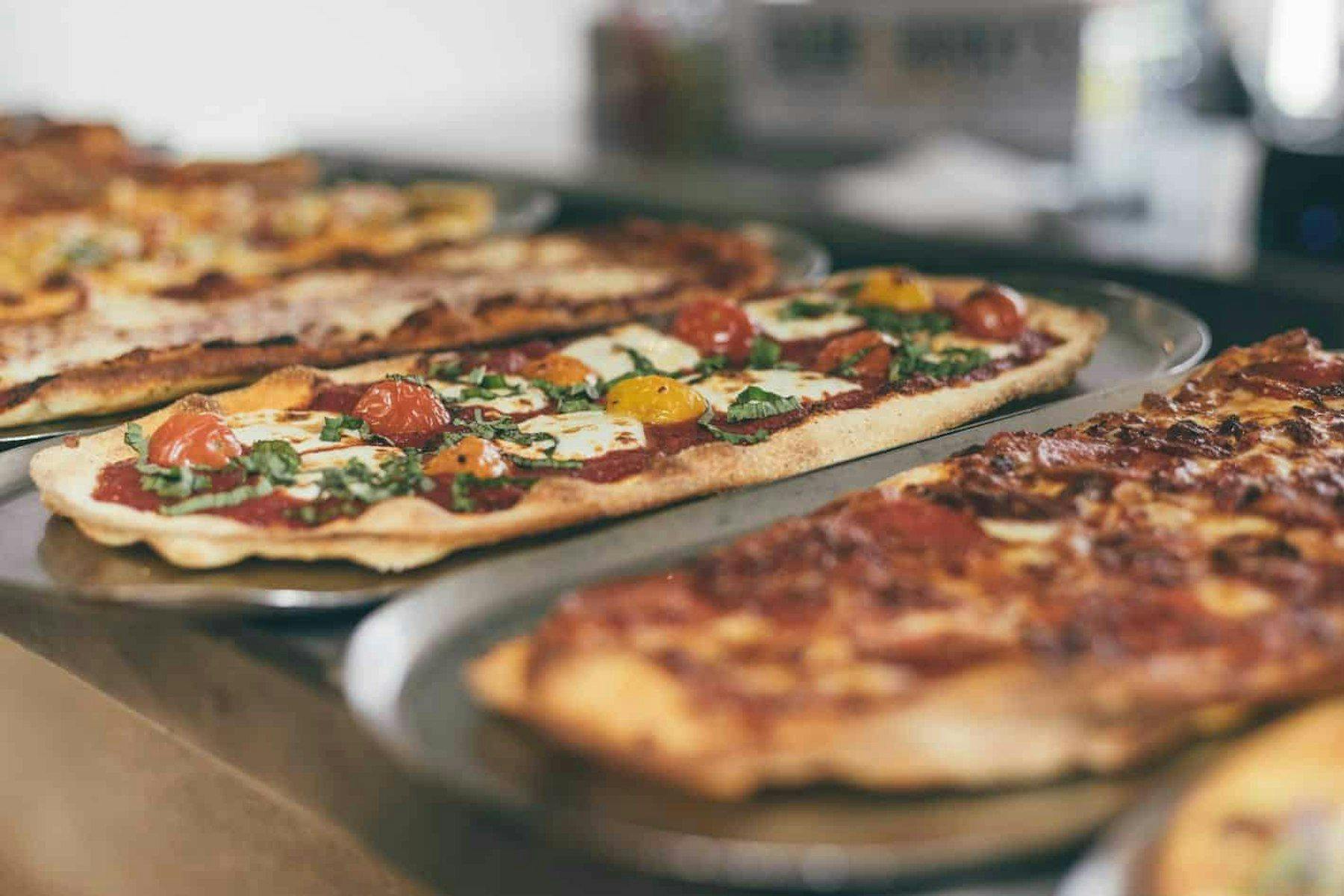 $50 Off Slim + Husky’s Pizza Catering